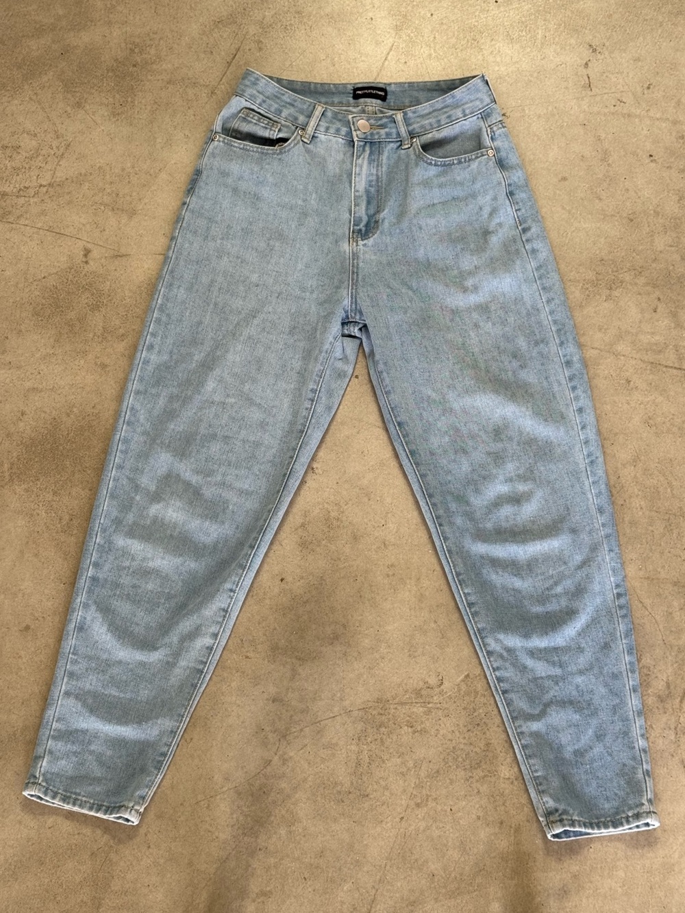Light wash high-waisted tapered jeans. Brand: Pretty Little Things